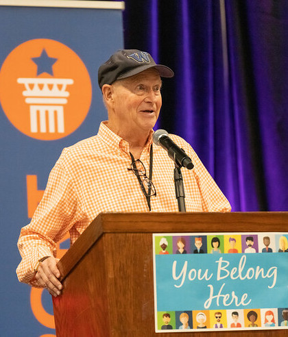 photo of Jim Eisenhardt at a podium accepting an award